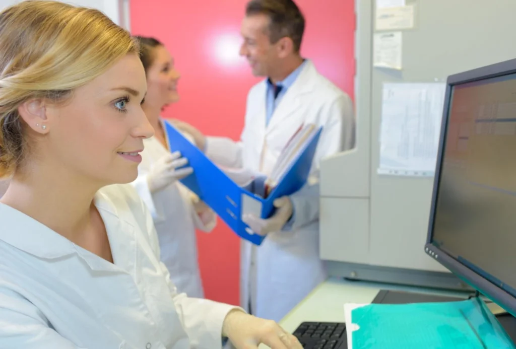 Medical research team conducting clinical investigation in laboratory environment